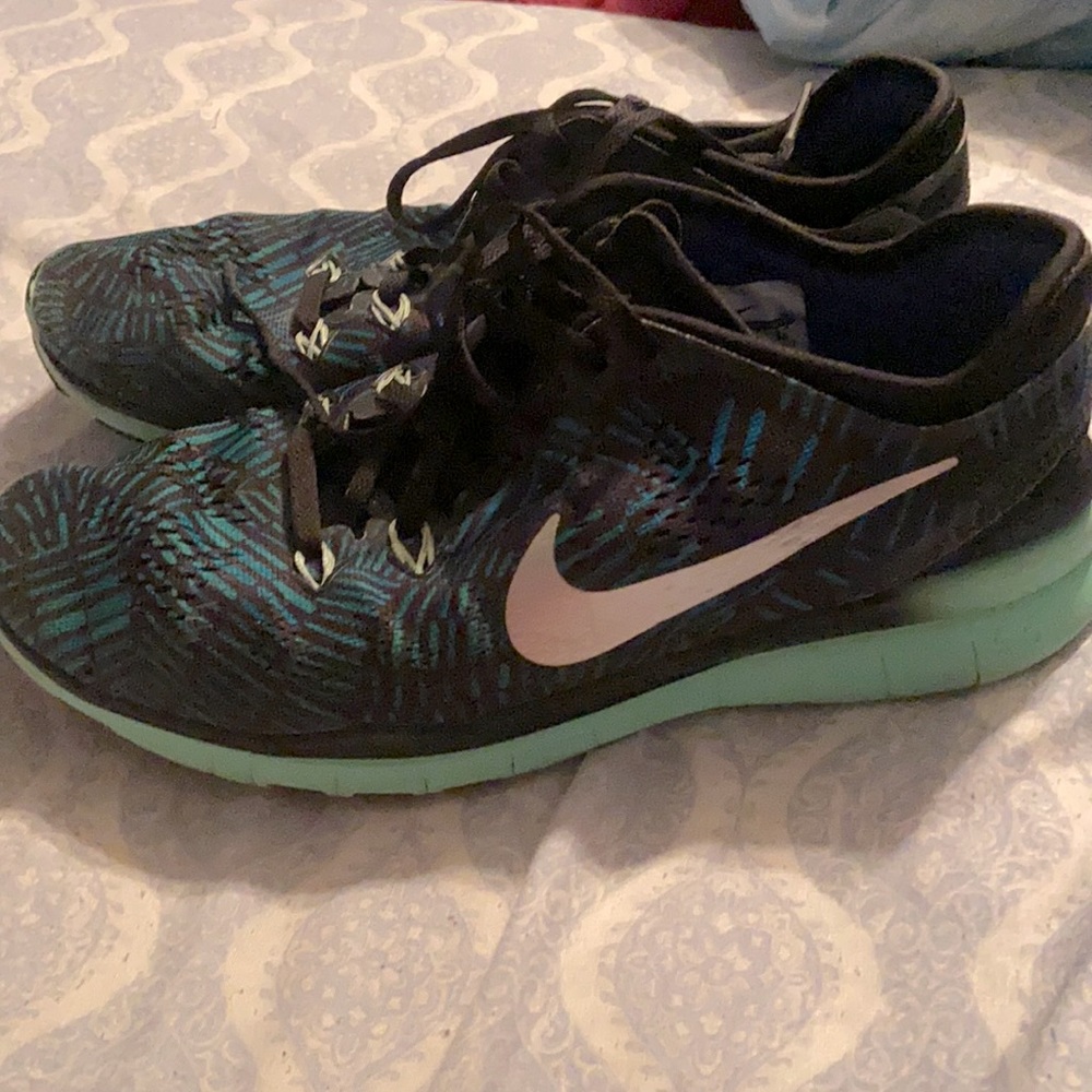 Nike tennis shoes. Blue,Teal, green, black.